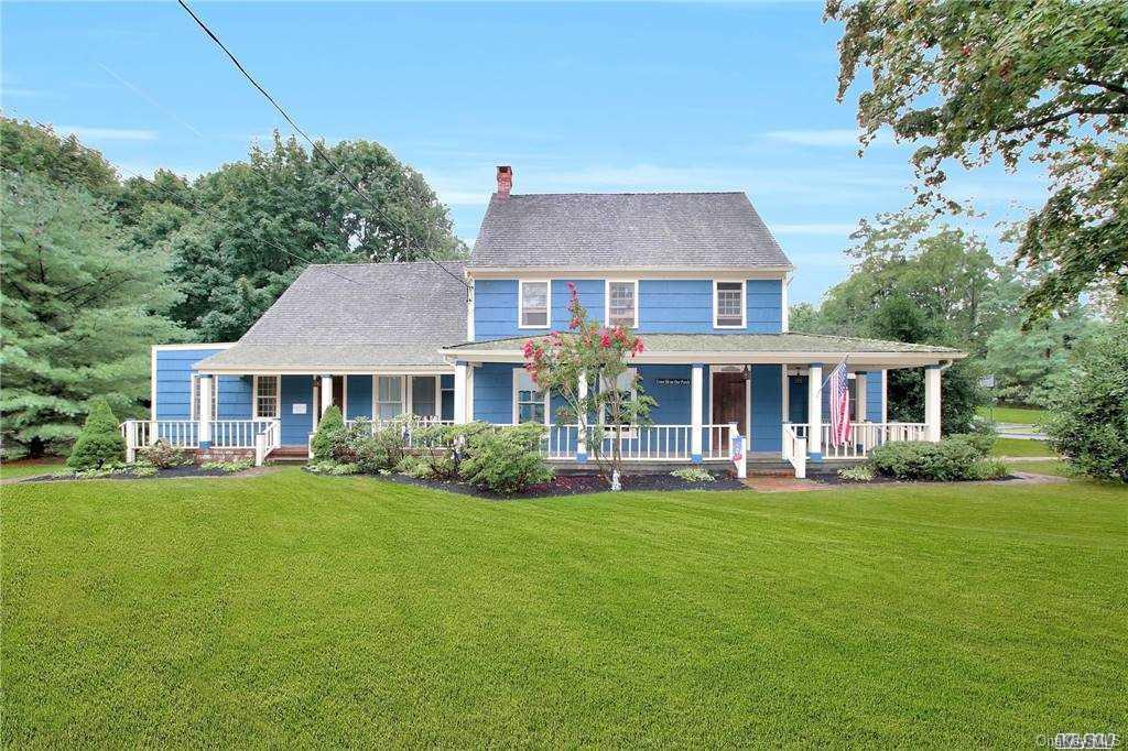178 North Country Road Miller Place, NY 11764 - Photo 1 of 1 a front view of a house with a garden