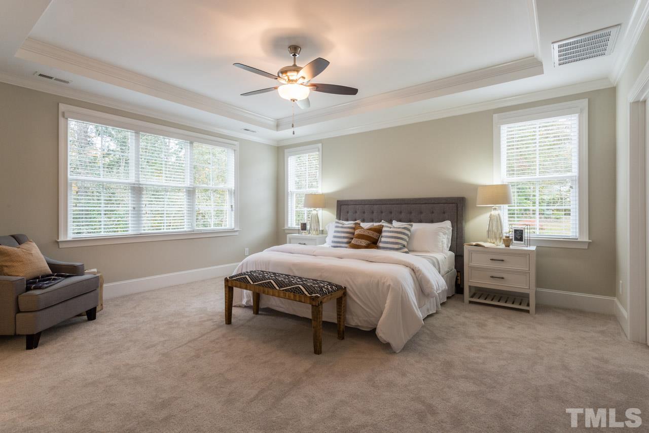 4613 Pleasant Pointe Way Raleigh, NC 27613 - Photo 14 of 25 a spacious bedroom with a bed and a couch