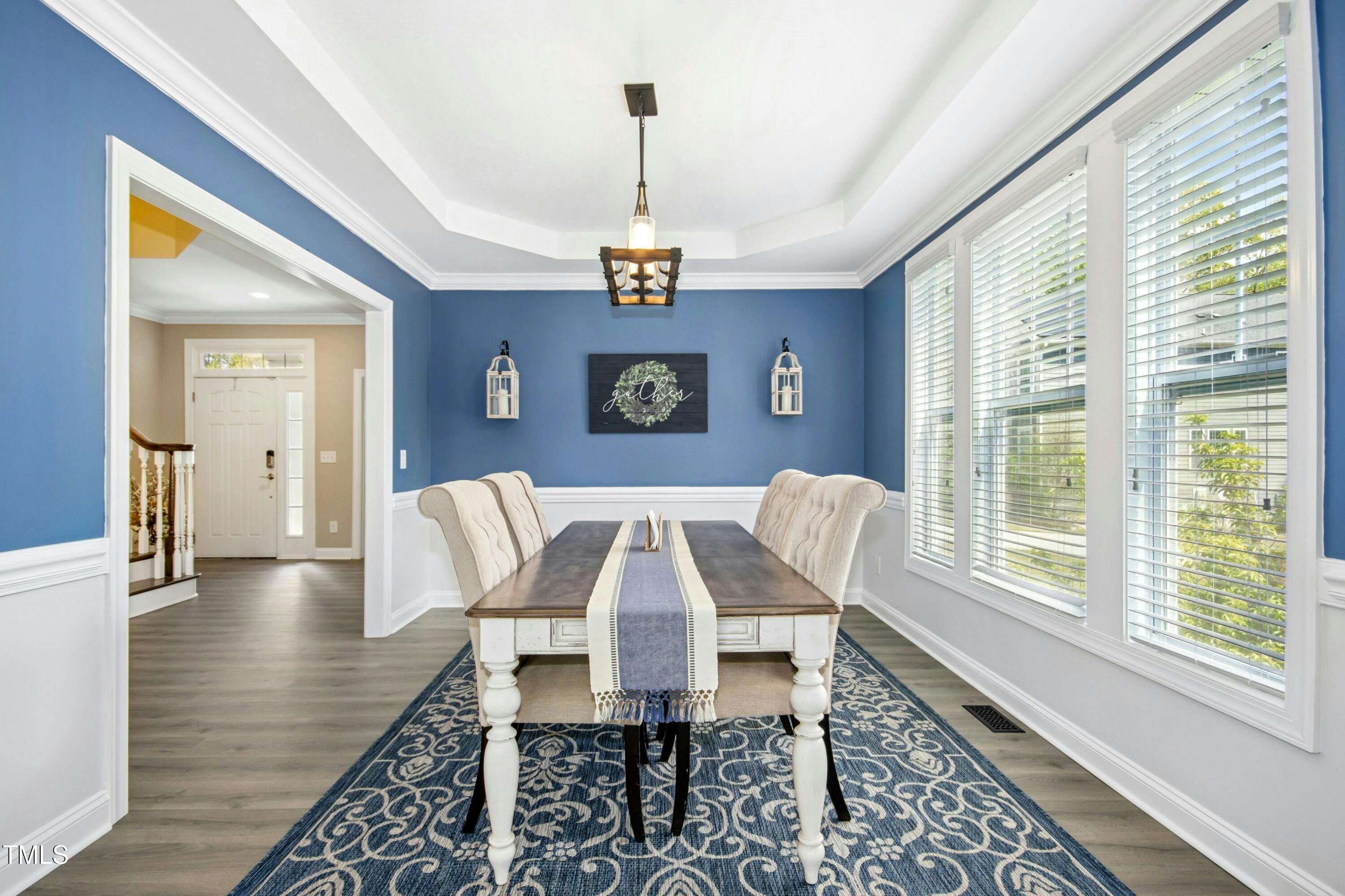 44 South Wilders Ridge Way Clayton, NC 27527 - Photo 9 of 56 a view of a dining room with furniture window and wooden floor