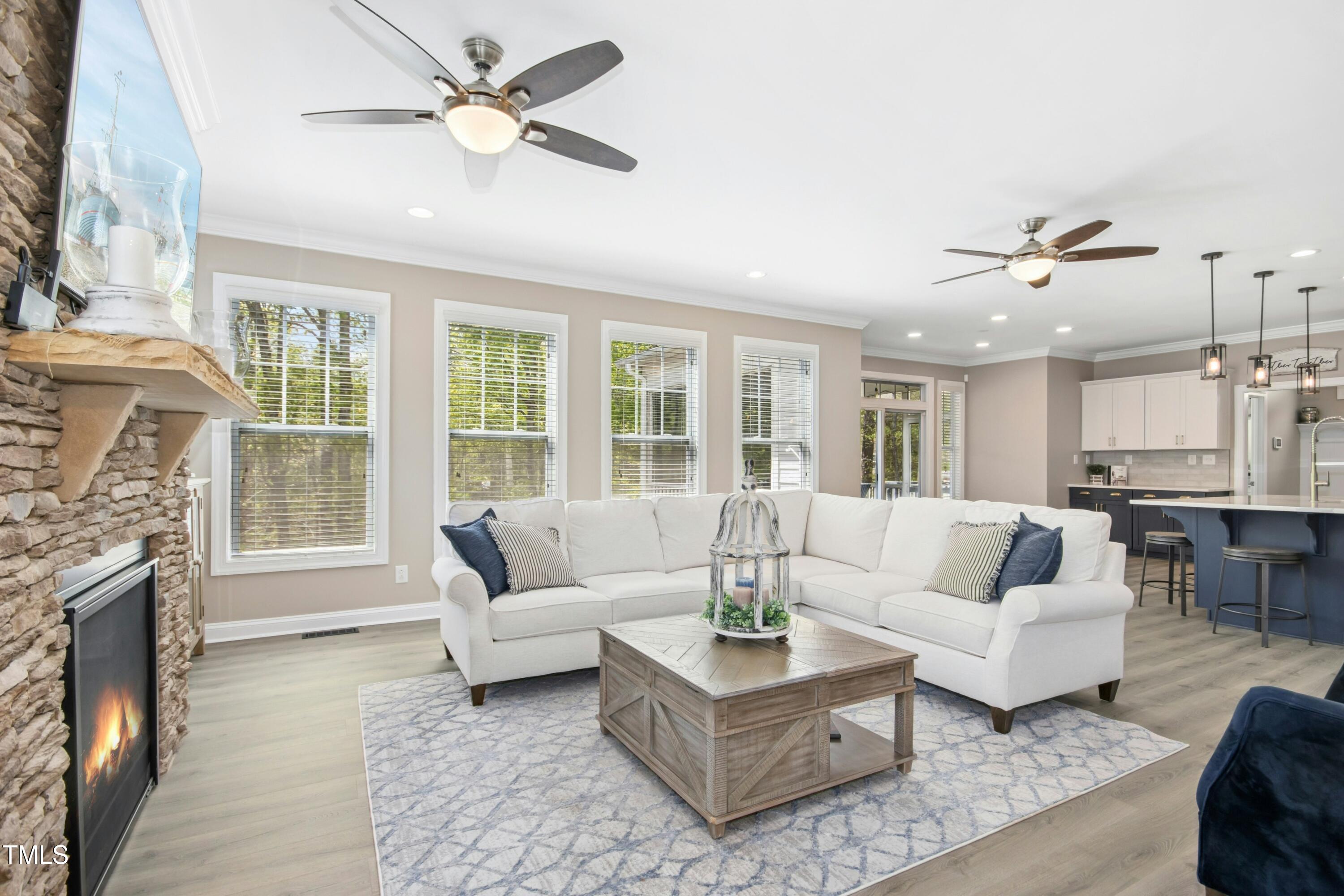 44 South Wilders Ridge Way Clayton, NC 27527 - Photo 13 of 56 a living room with furniture and a fireplace