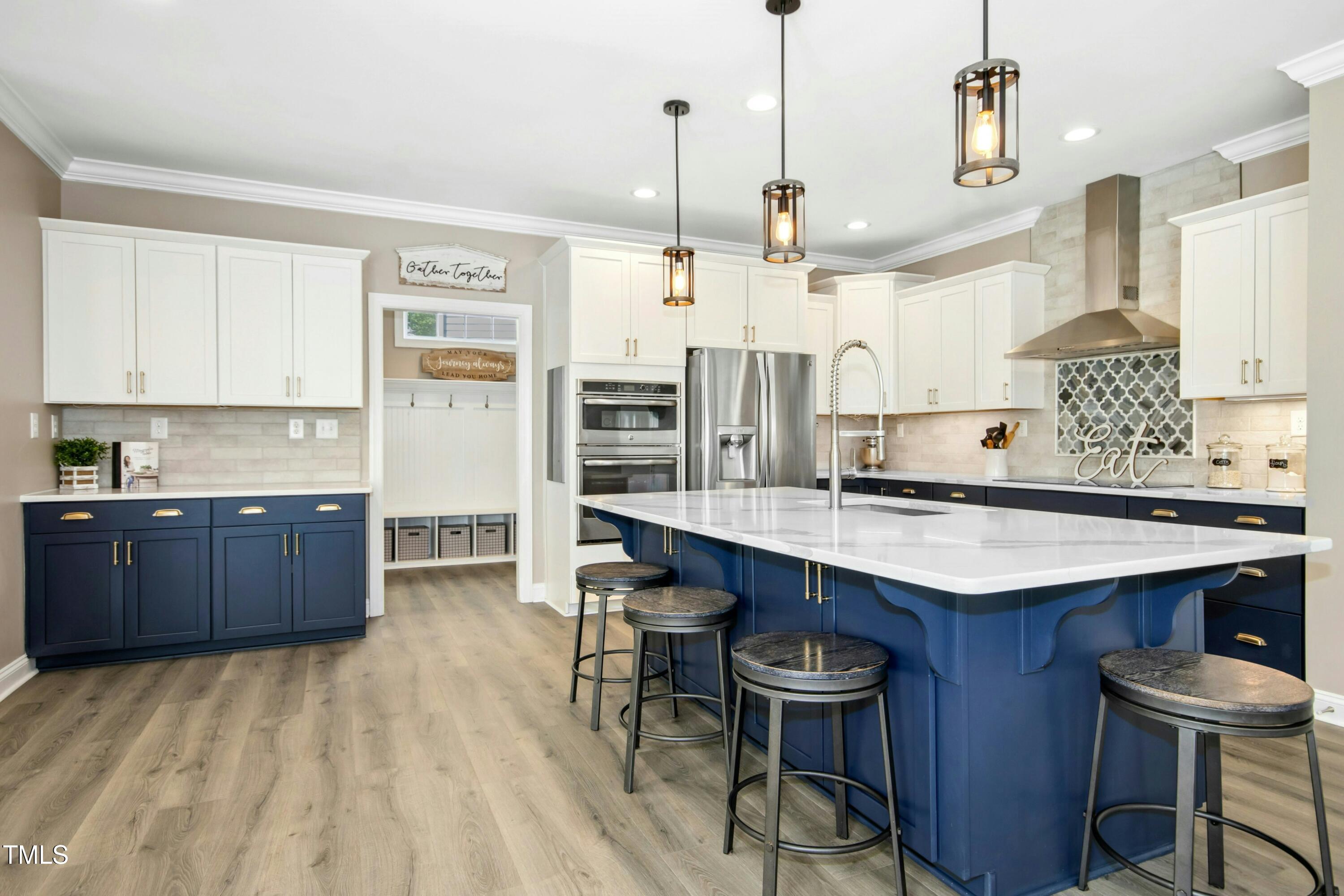 44 South Wilders Ridge Way Clayton, NC 27527 - Photo 15 of 56 a kitchen with stainless steel appliances granite countertop a sink stove and refrigerator