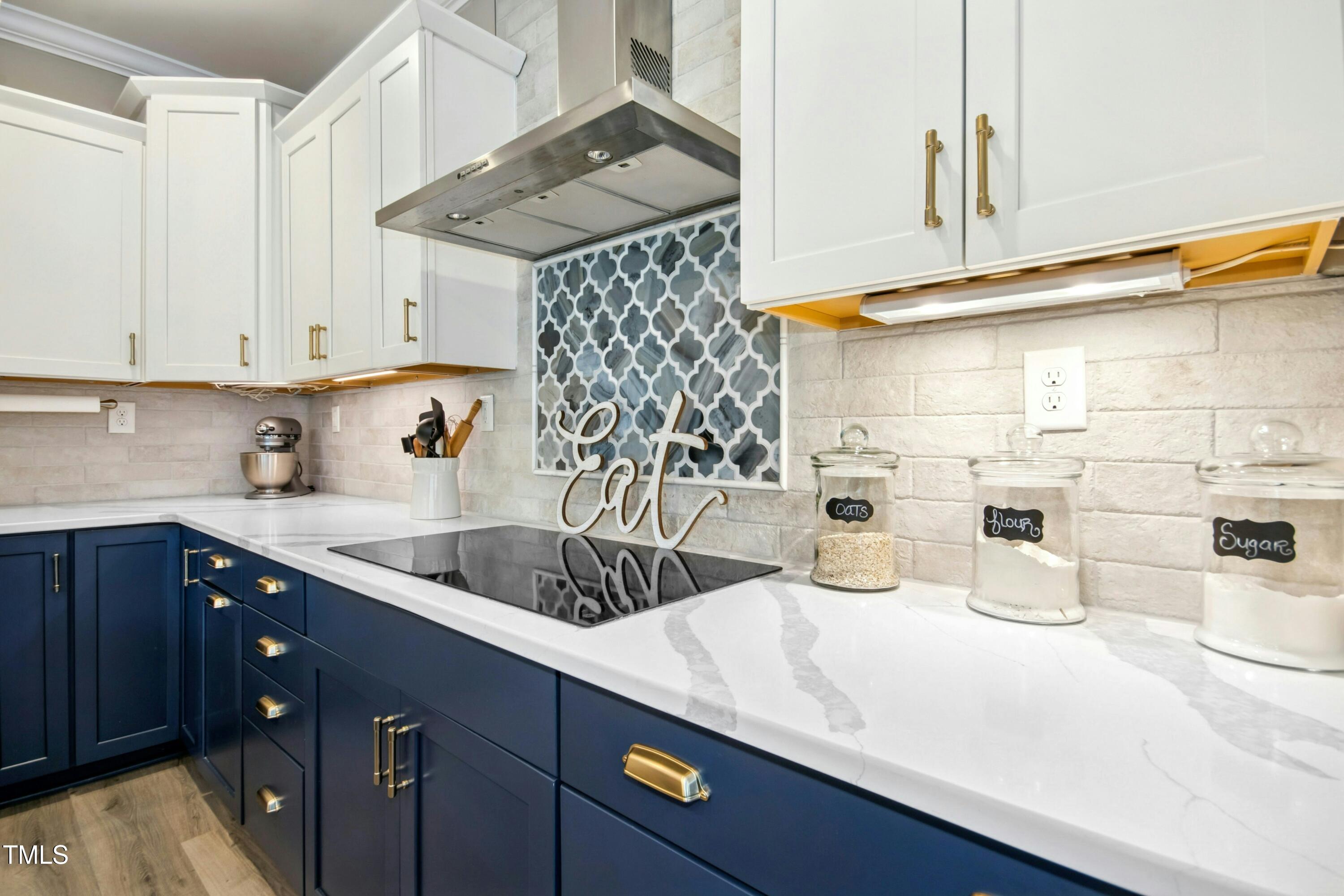 44 South Wilders Ridge Way Clayton, NC 27527 - Photo 18 of 56 a kitchen with a sink a stove and cabinets