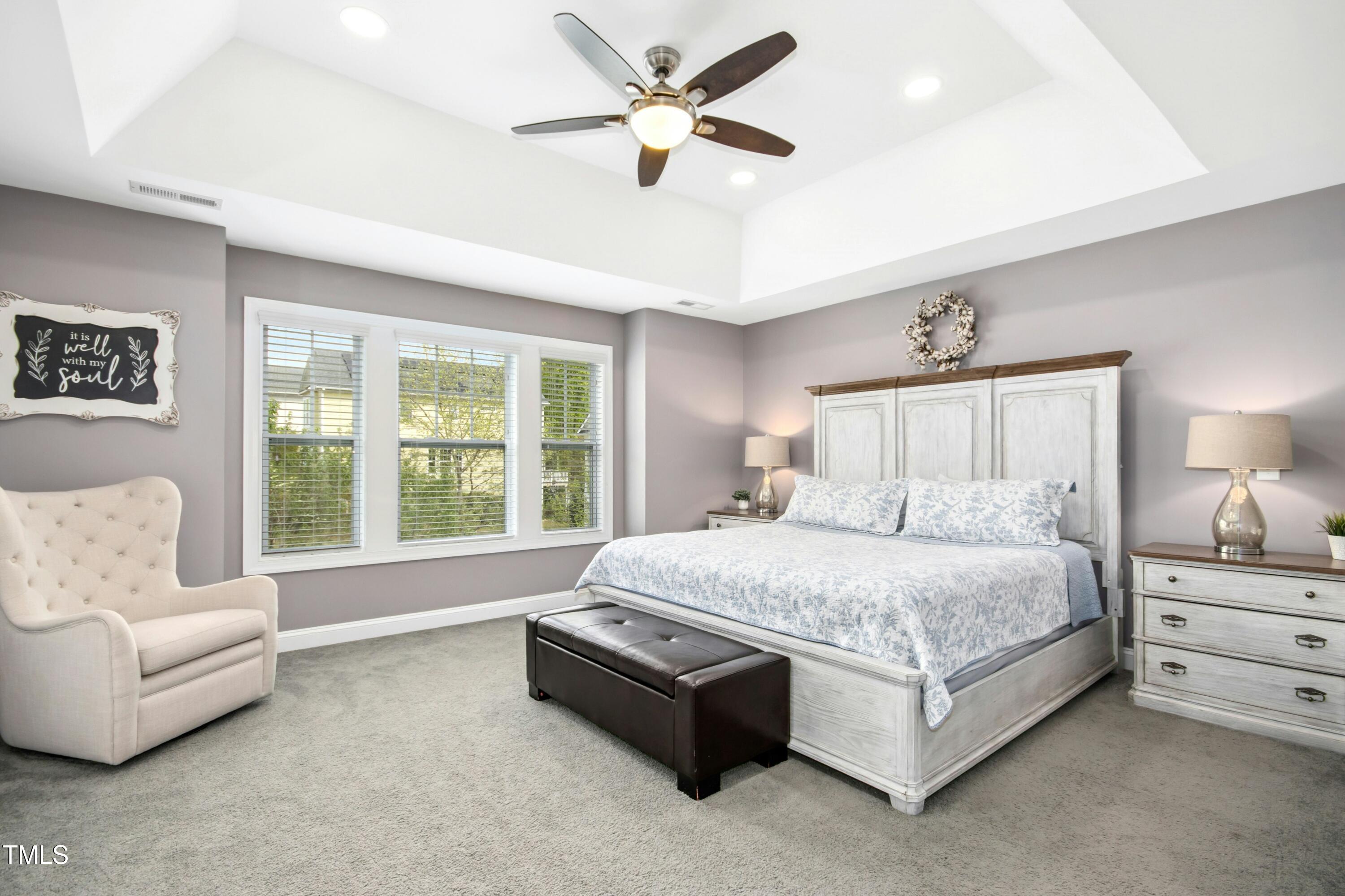 44 South Wilders Ridge Way Clayton, NC 27527 - Photo 23 of 56 a spacious bedroom with a bed couch and window