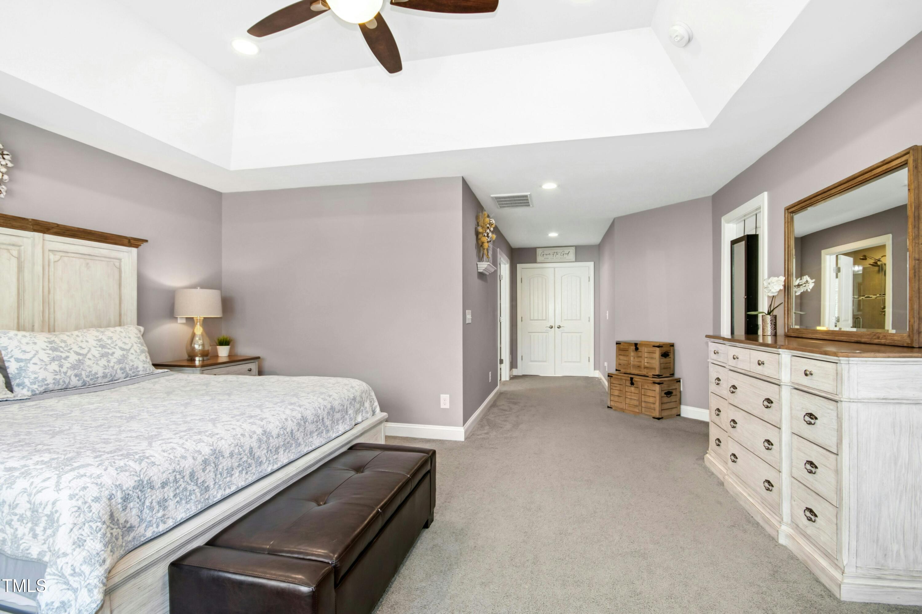 44 South Wilders Ridge Way Clayton, NC 27527 - Photo 25 of 56 a bedroom with a bed and dresser