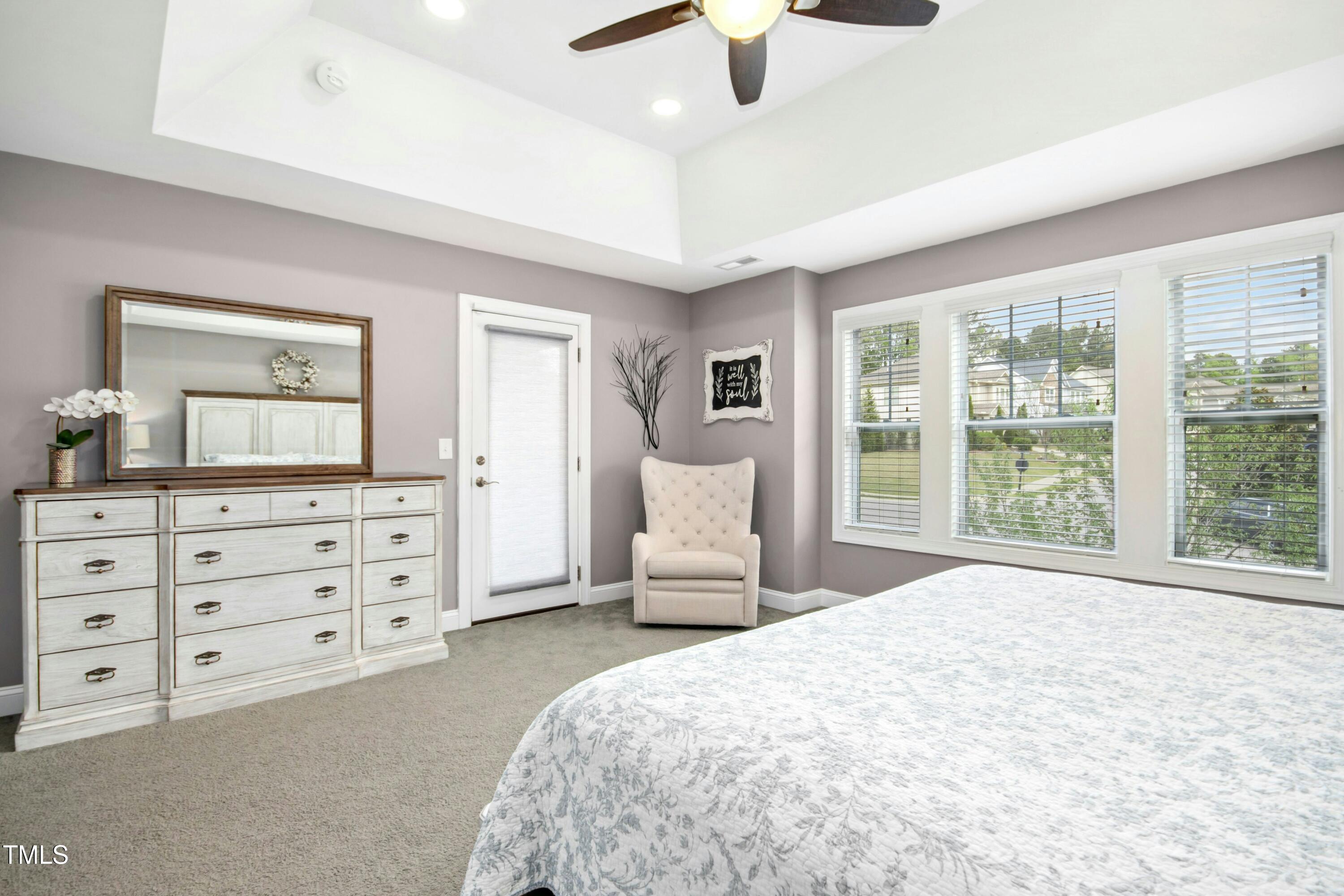 44 South Wilders Ridge Way Clayton, NC 27527 - Photo 26 of 56 a bedroom with a large bed and a dresser