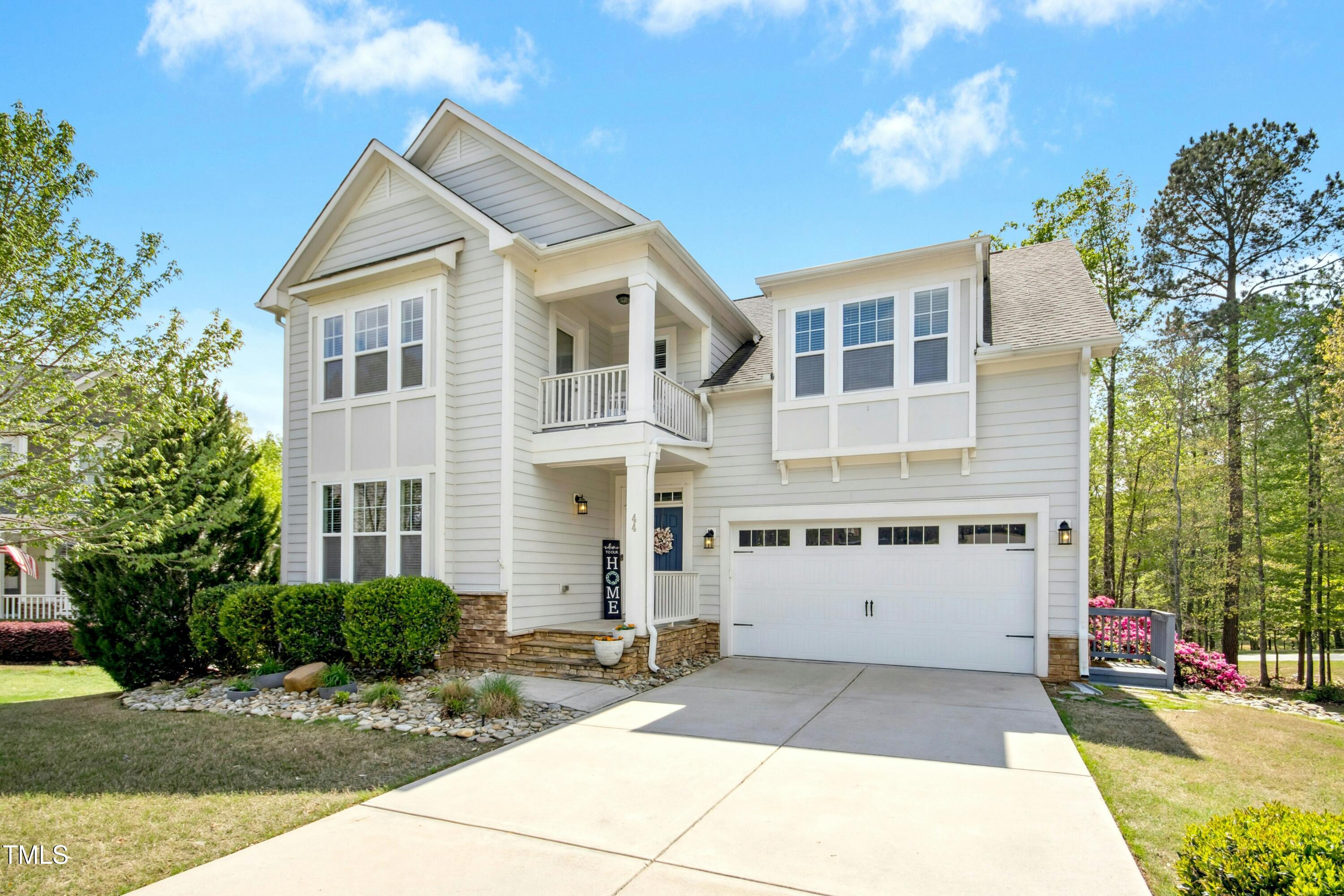 44 South Wilders Ridge Way Clayton, NC 27527 - Photo 2 of 56 a front view of a house with a yard