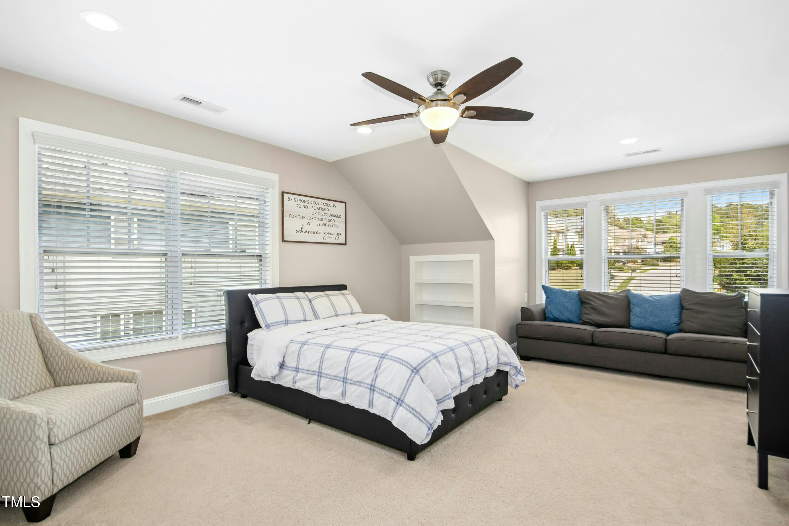 44 South Wilders Ridge Way Clayton, NC 27527 - Photo 32 of 56 a bedroom with a bed couch and window