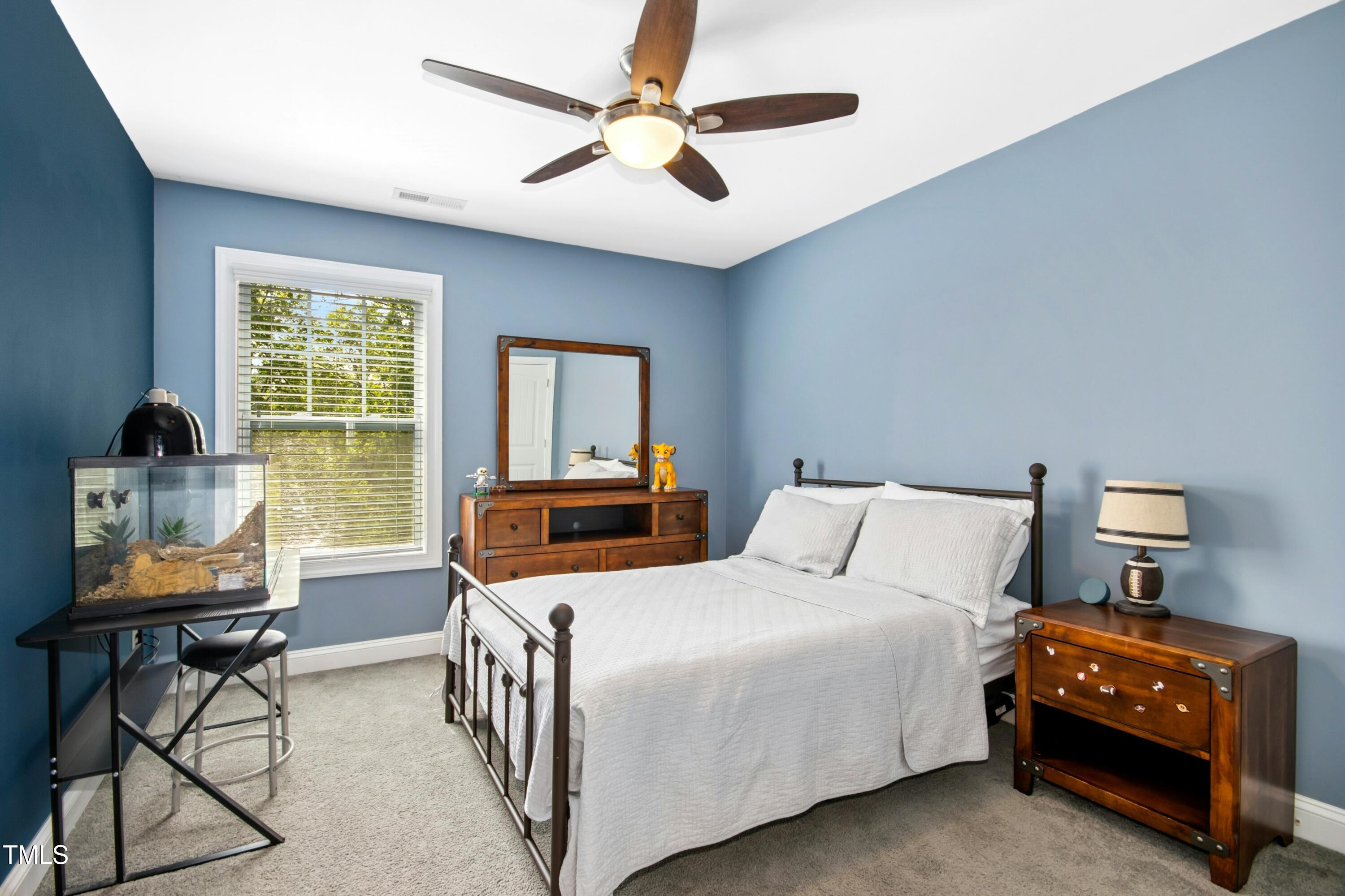 44 South Wilders Ridge Way Clayton, NC 27527 - Photo 34 of 56 a bedroom with two beds and a window