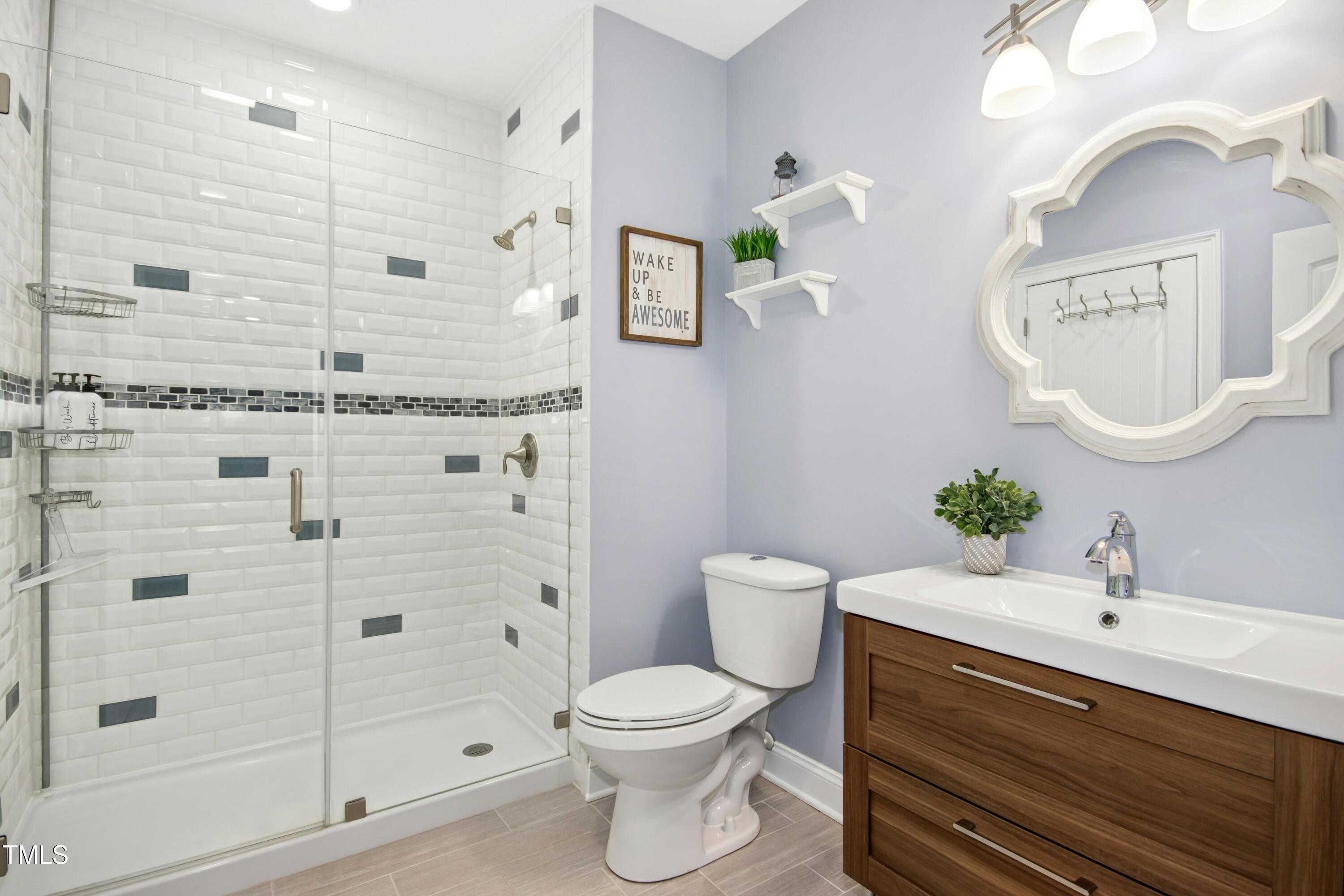 44 South Wilders Ridge Way Clayton, NC 27527 - Photo 41 of 56 a bathroom with a sink a toilet and shower