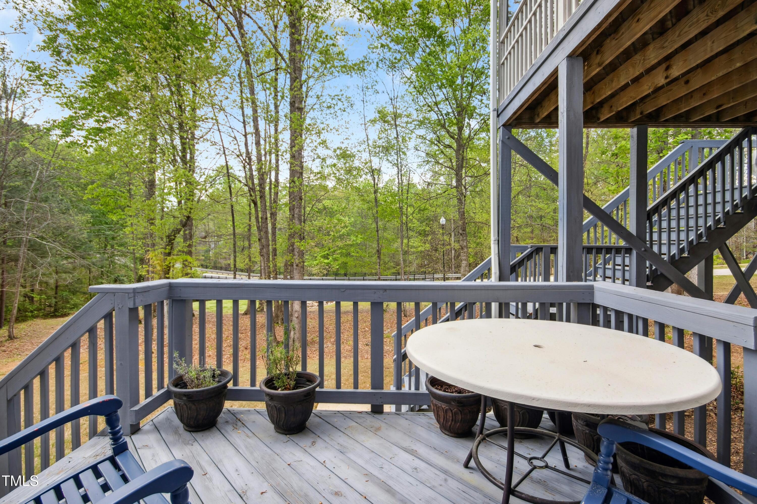 44 South Wilders Ridge Way Clayton, NC 27527 - Photo 45 of 56 a view of a balcony with furniture and wooden deck