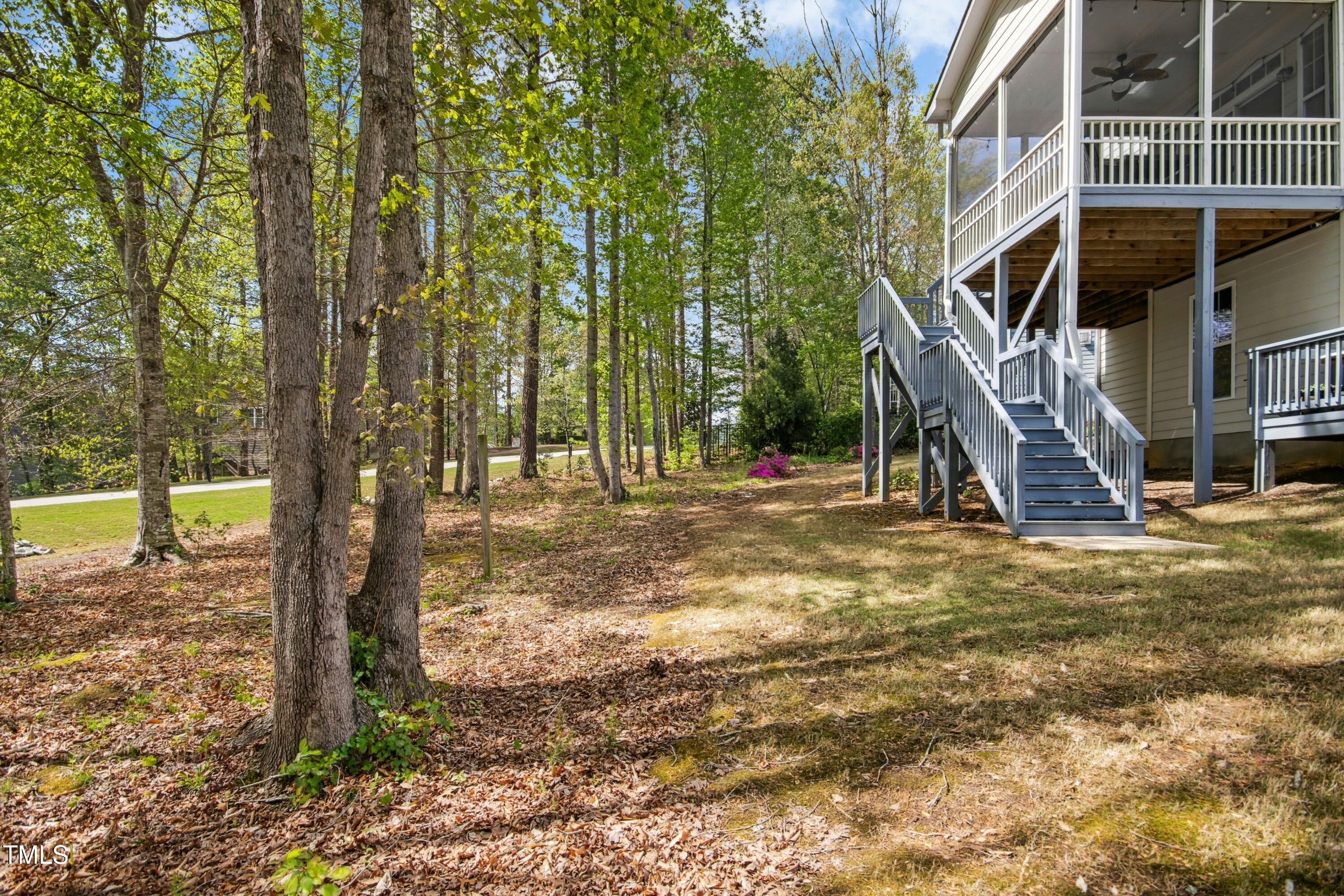 44 South Wilders Ridge Way Clayton, NC 27527 - Photo 46 of 56 a view of outdoor space with deck and trees