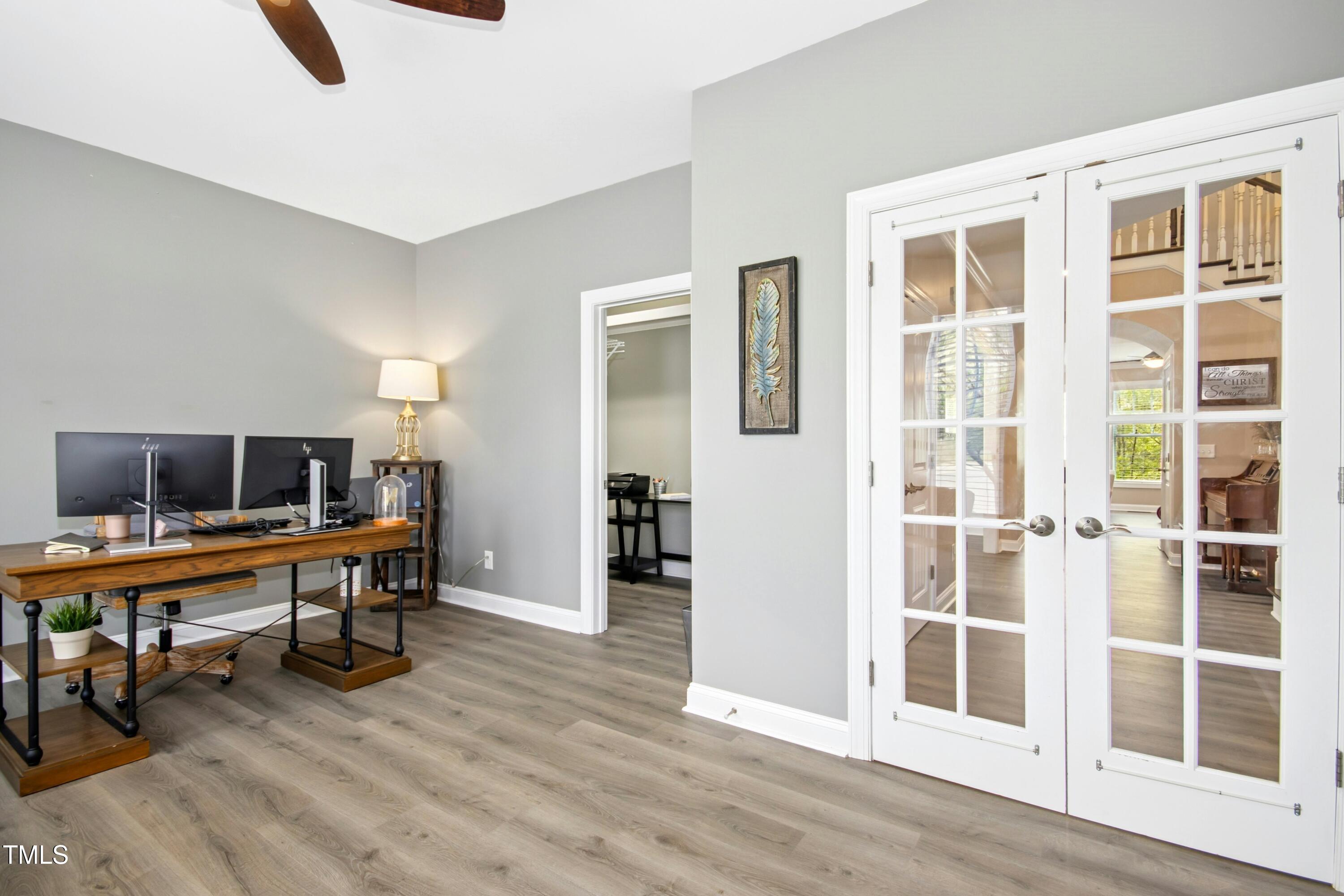 44 South Wilders Ridge Way Clayton, NC 27527 - Photo 7 of 56 a view of a workspace with furniture and wooden floor