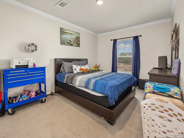 a bedroom with bed and a window