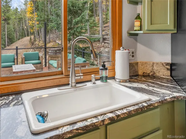 a kitchen with a sink and a window