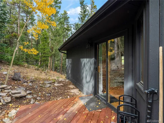 a wooden deck with sunset view