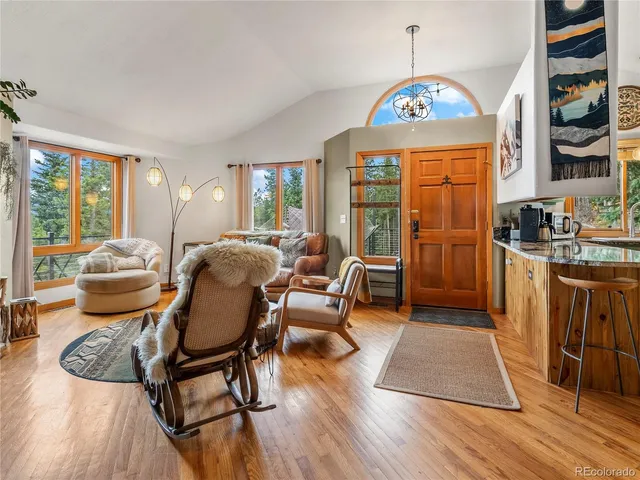 a view of a dining room with furniture window and wooden floor