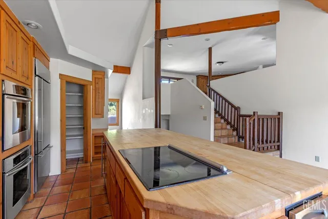 a view of a balcony with wooden floor and fence