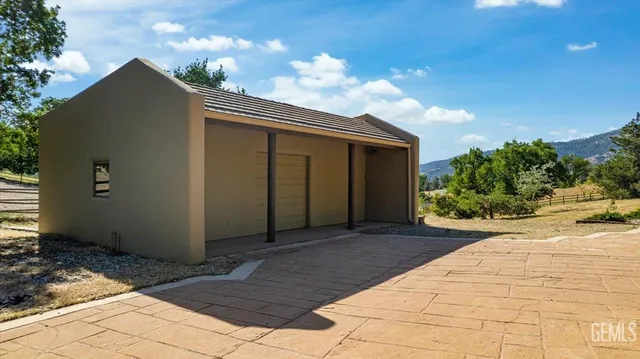 a view of an entryway with wooden floor and a front door