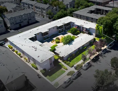 an aerial view of a house with a garden