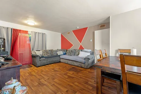 a bedroom with a bed and a dresser