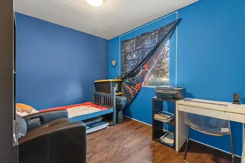 a view of washer and dryer with kitchen in the background