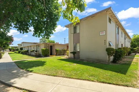 a view of a house with a yard