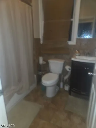 a bathroom with a toilet and a sink