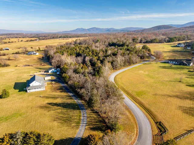 a view of an ocean and a mountain