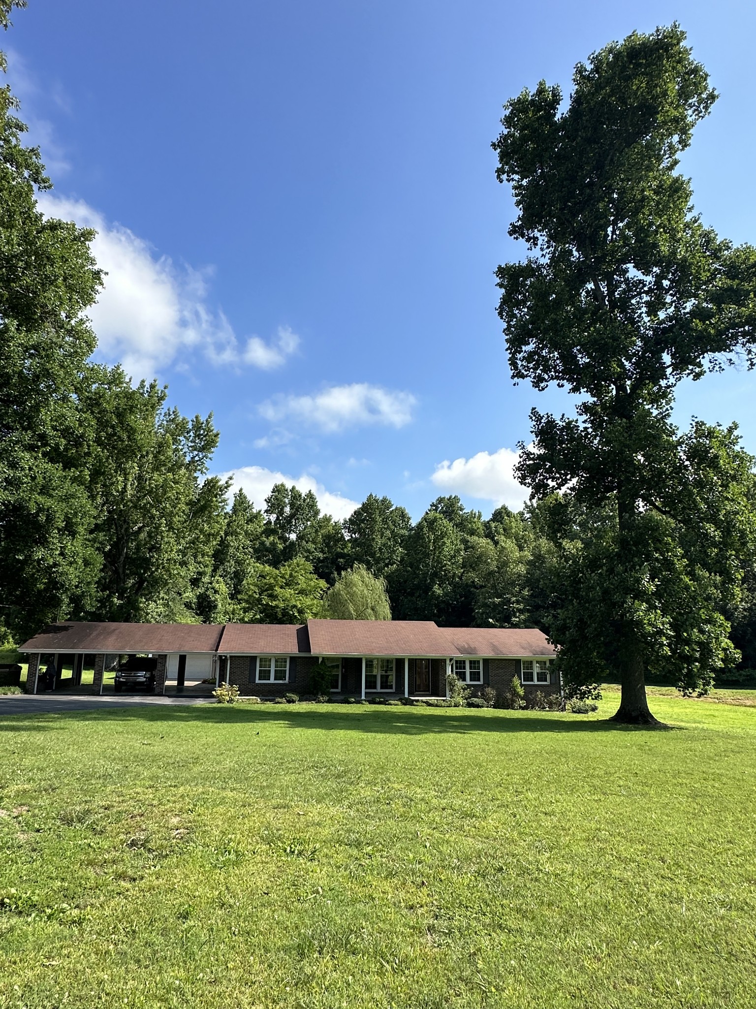 78 Old Quick Road Fayetteville, TN 37334 - Photo 1 of 1 a front view of a house with a garden