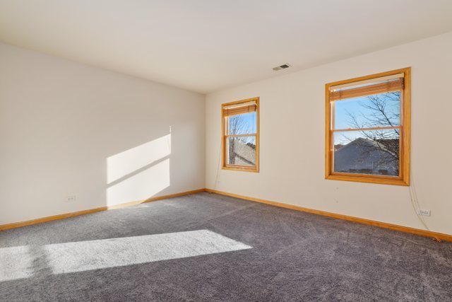 1350 Hunters Ridge West Hoffman Estates, IL 60192 - Photo 19 of 41 a view of an empty room with a window