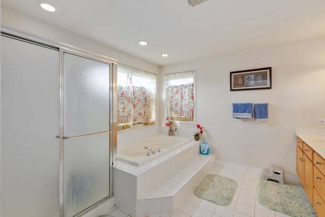1350 Hunters Ridge West Hoffman Estates, IL 60192 - Photo 23 of 41 a bathroom with a sink toilet and shower
