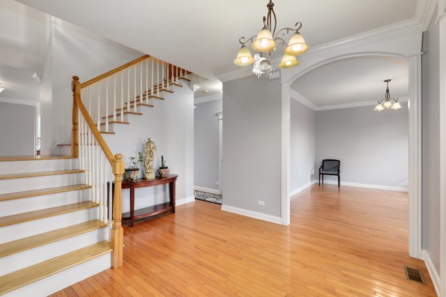 1350 Hunters Ridge West Hoffman Estates, IL 60192 - Photo 4 of 41 a view of entryway and hall with wooden floor