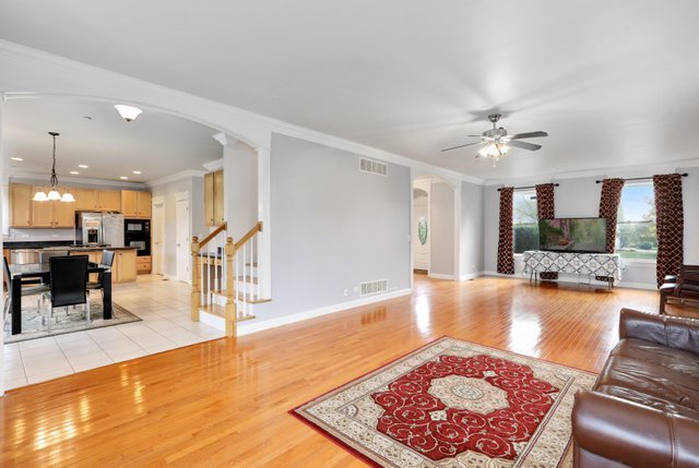1350 Hunters Ridge West Hoffman Estates, IL 60192 - Photo 8 of 41 a living room with furniture and a table