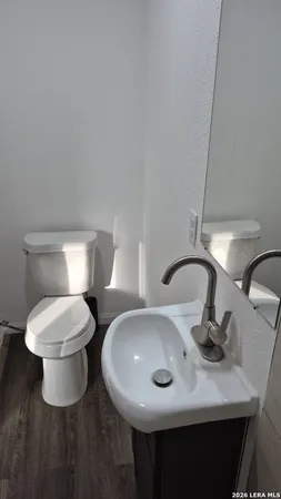a bathroom with a sink a mirror and shower