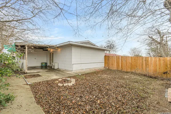 a view of a backyard of the house