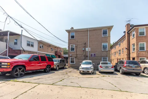 a view of a cars parked in front of a house