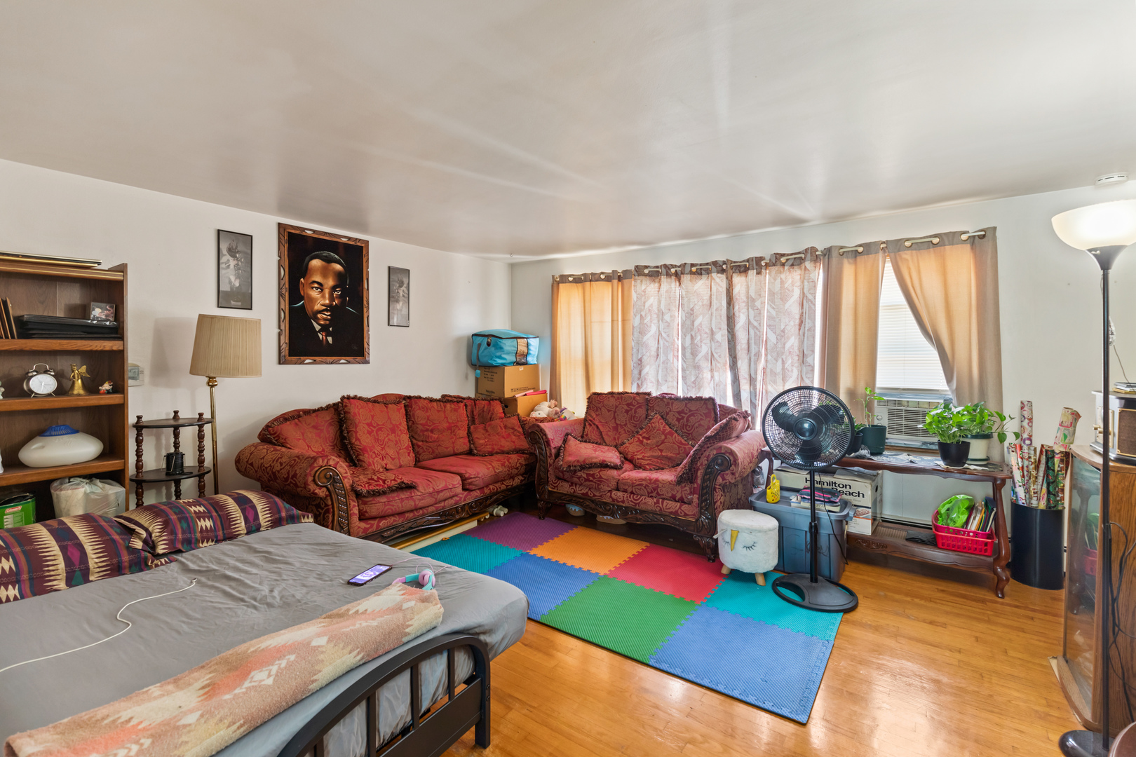 2650 West Touhy Avenue Chicago, IL 60645 - Photo 2 of 17 a living room with furniture and a large window