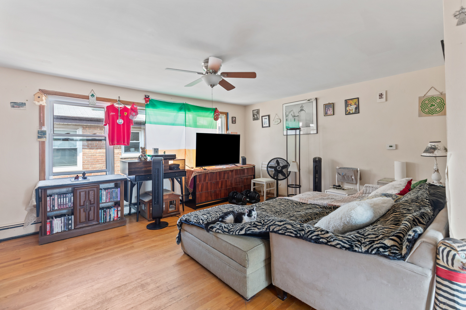 2650 West Touhy Avenue Chicago, IL 60645 - Photo 4 of 17 a living room with furniture kitchen view and a flat screen tv