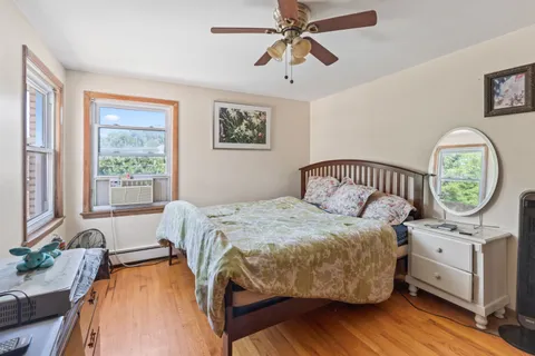 a bedroom with a bed and a table in it