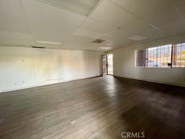2176 West Foothill Boulevard, Unit B Upland, CA 91786 - Photo 2 of 7 an empty room with wooden floor and windows