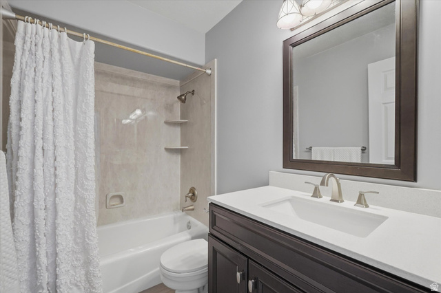 5576 South 4100th Street West Roy, UT 84067 - Photo 27 of 35 Remodeled Bathroom featuring a built-in tub with shower, integrated shelving, and a vanity and sink