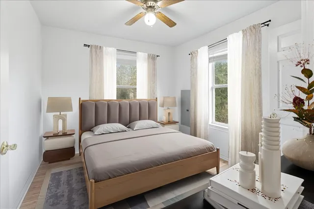 a bedroom with a bed and a window