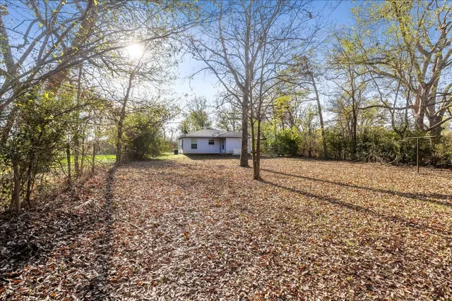 a house with trees in front of it