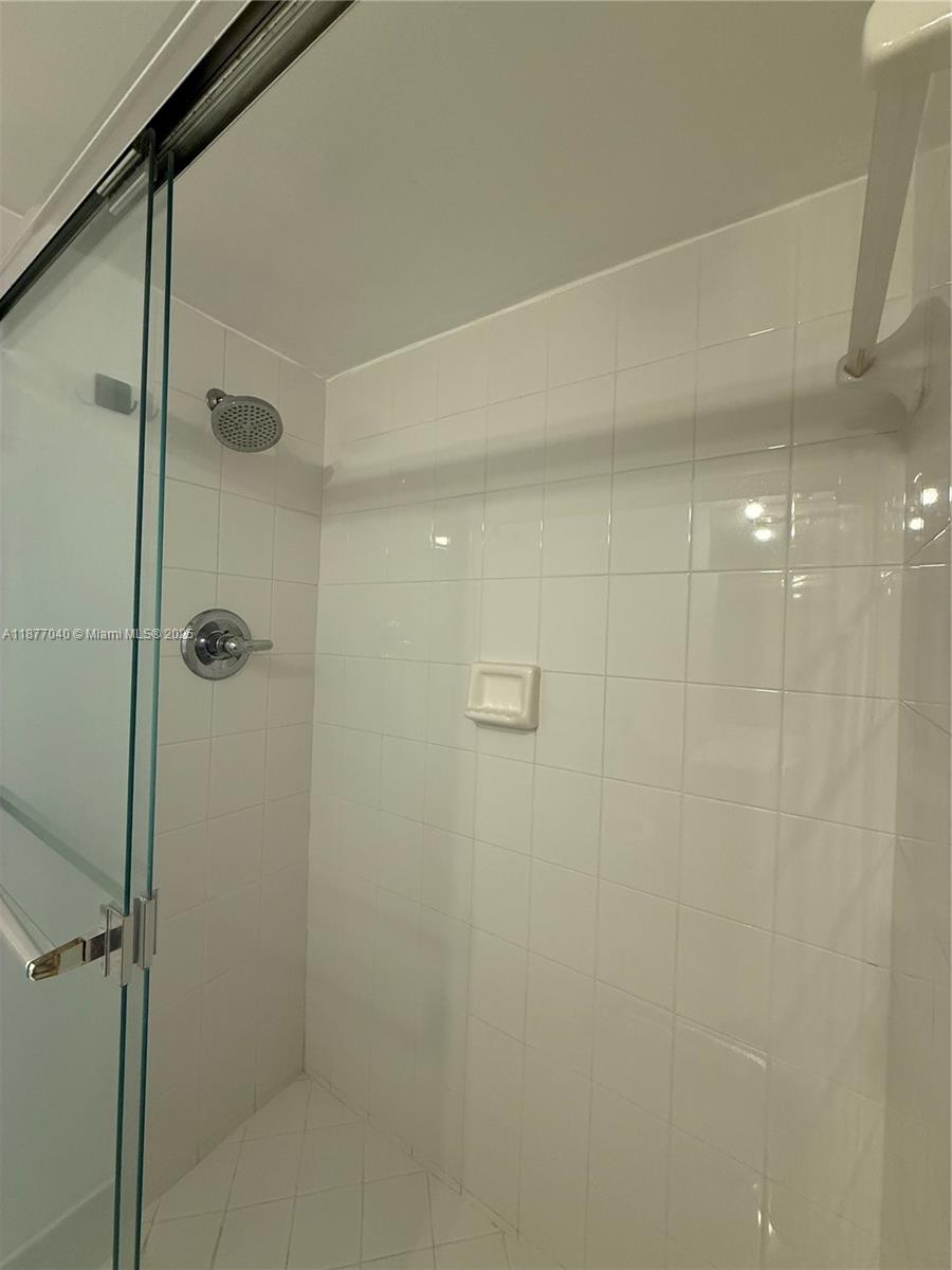 5161 Collins Avenue, Unit 511 Miami Beach, FL 33140 - Photo 11 of 29 a bathroom with a shower