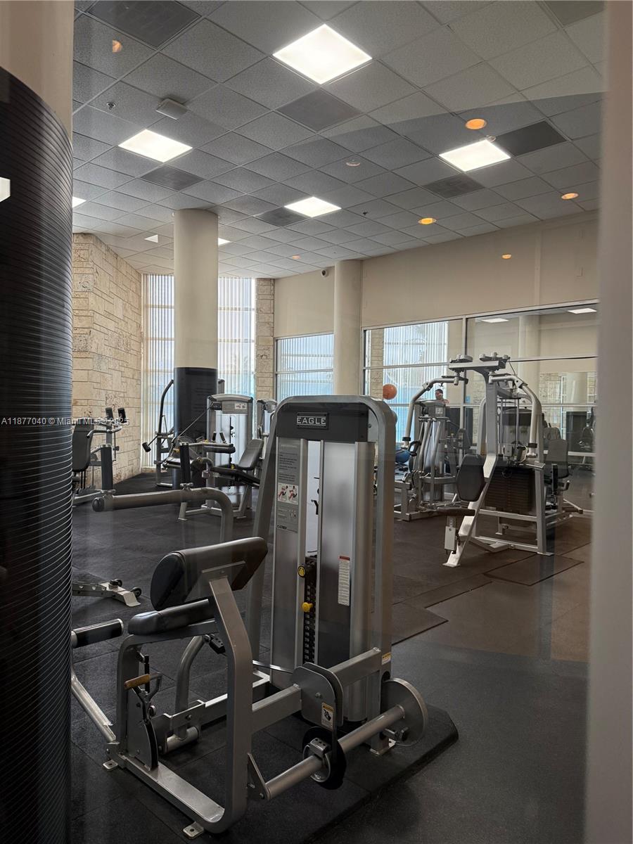 5161 Collins Avenue, Unit 511 Miami Beach, FL 33140 - Photo 16 of 29 a room with gym equipment