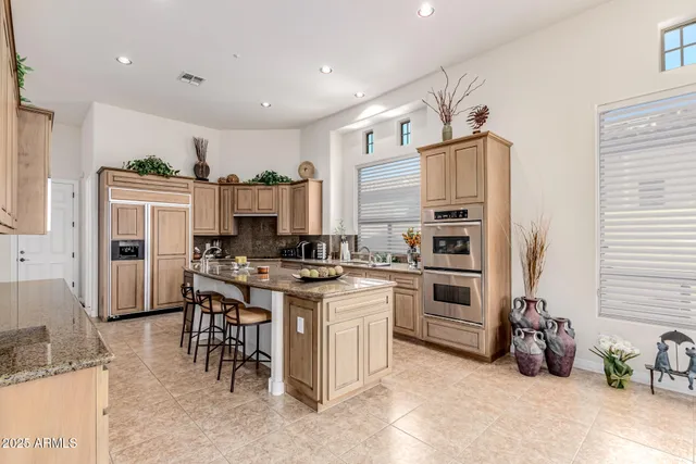 a bedroom with a bed and ceiling fan