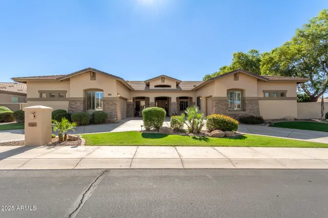 a front view of a house with a yard and porch