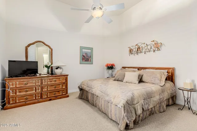 an aerial view of a house with a yard and garden