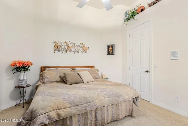 an aerial view of residential houses with outdoor space and parking