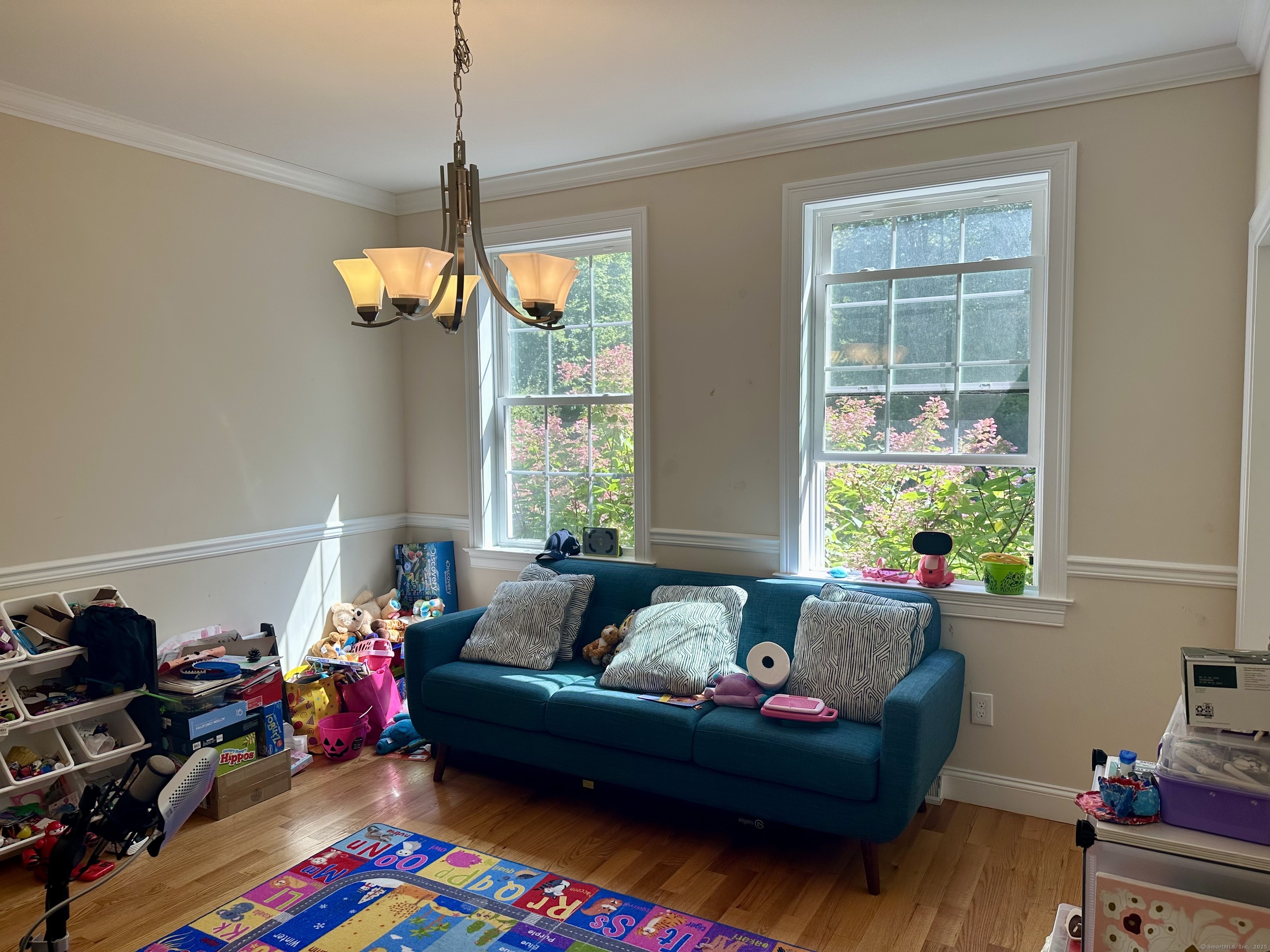 102 Pheasant Lane Granby, CT 06060 - Photo 12 of 33 a living room with furniture and a window